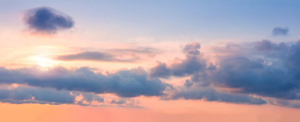 Panorama of Gentle pastel sunrise sundown sky background with colorful clouds