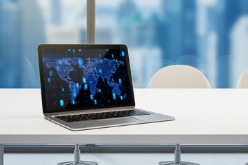 designer workpace with laptop and abstract glowing map hologram on screen. Blurry window with city view background. Digital world, transformation and future cyber space concept. 3D Rendering.