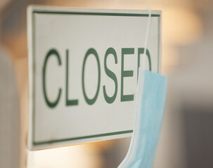 Covid face mask, closed and door signage on cafe, restaurant or coffee shop glass window in...
