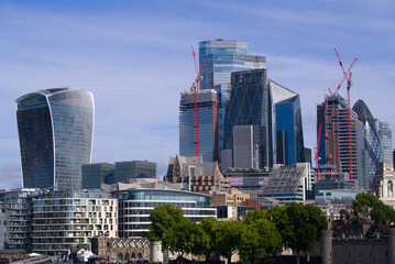 Modern skyline of finance district with Tower of London in the foreground at City of London on a...