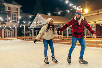 Active couple at skating rink