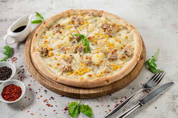 Hawaiian pizza with chicken meat, pineapple and corn