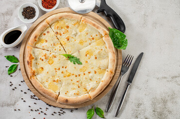 Fresh hot cheese pizza on the concrete background