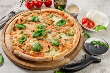 Fresh hot cheese pizza on the concrete background