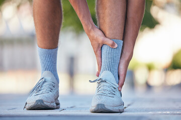 Man, feet or ankle pain in running fitness, training or exercise in New York city, street or road. Zoom, personal trainer or runner with sports injury in legs from workout burnout or anatomy accident
