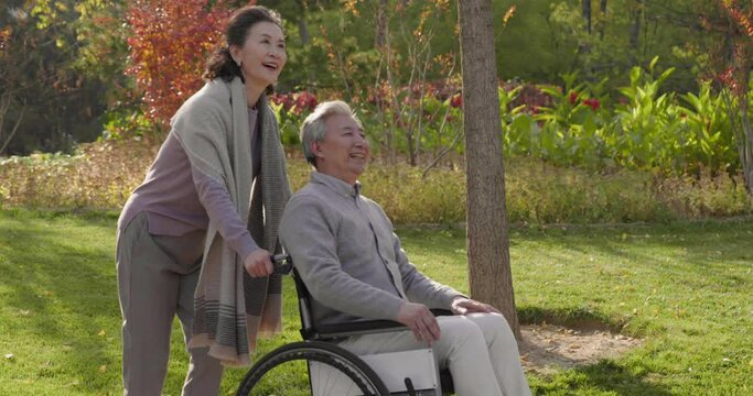 Senior Chinese woman with wheelchair bound husband,4K