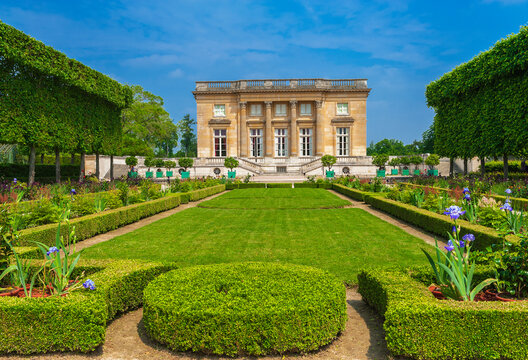 View on Trianon in the gardens of Versailles palace, France