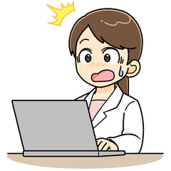 パソコンの前で驚く白衣の女性