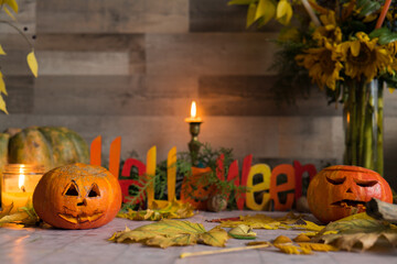 Scary Halloween pumpkins glowing at night as decoration on the front steps