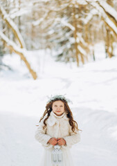 Fototapeta na wymiar Funny Little Girl Having Fun in Beautiful Winter Park.