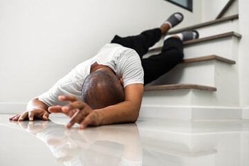 A young man faints and collapses on the stairs of the house. He was injured in an accident and fell down the stairs. He was alone in the house not being helped by anyone. Broken bone