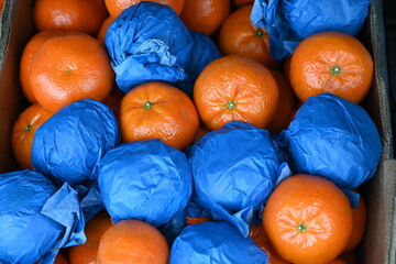 Citrus fruits wrapped in blue