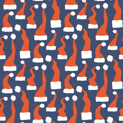 Seamless pattern of Santa hats on a blue background. Christmas traditional clothes for head.