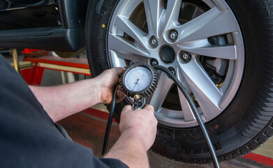 mechanic, garage, tyre, checking the tyre pressure, automotive, detail of a car, 