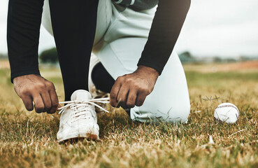 Baseball, shoes and grass with ball and baseball player, sports and fitness closeup during game on...