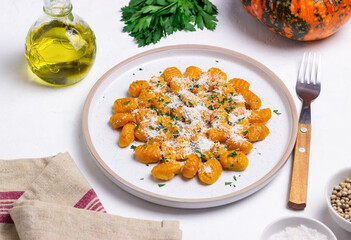 Pumpkin gnocchi with Parmesan cheese and herbs. Healthy eating. Vegetarian food.