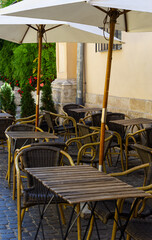 Cozy street with cafe tables in Lviv, Ukraine. Summer street cafe