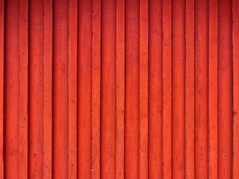 Traditional scandinavian red wooden facade pattern as background