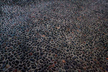 Wet paving stone background texture. Selective focus