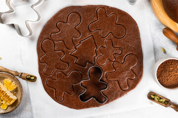 Christmas Baking background. Ingredients for cooking christmas baking on light background. Top view with copy space. Gingerbread cookies. Baking Ginger cookies. Raw dought for cookies