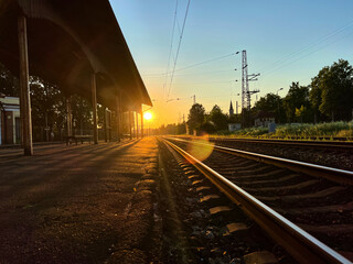 Fototapeta na wymiar Old railway station, sunset time. Selective focus