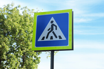 traffic sign Pedestrian Crossing against blue sky