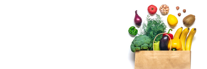 Eco friendly paper shop bag with raw organic green vegetables isolated on white background Flat...