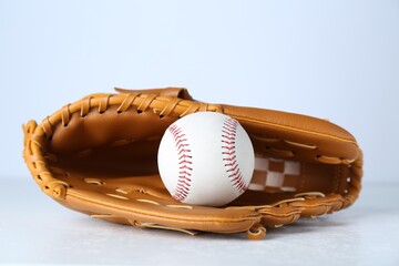 Catcher's mitt and baseball ball on white background. Sports game