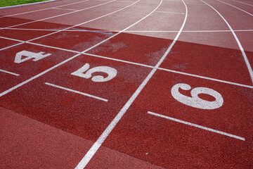 Athletics track surface. Running track with lane markings and numbers. sports backdrop.