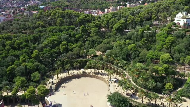 Parc Guell in Barcelona, seen from above over the tree tops, summer.