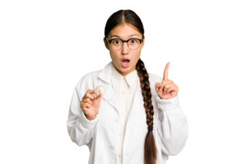 Young asian otorhinolaryngologist woman holding a hearing aid isolated having some great idea, concept of creativity.