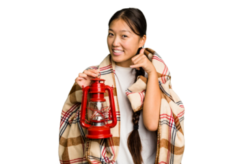 Young asian woman wearing a blanket and holding a lamp isolated showing a mobile phone call gesture with fingers.