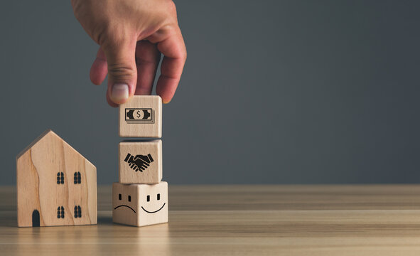 approve loans buy homes, Customer buying real estate or property concept, man's hand picked up wooden block with icon buy house.