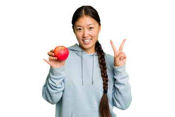 Young asian woman holding a red apple isolated showing number two with fingers.