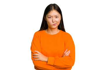 Young Asian woman isolated frowning face in displeasure, keeps arms folded.