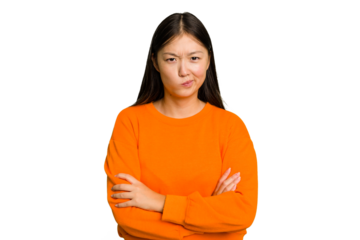 Young Asian woman isolated frowning face in displeasure, keeps arms folded.