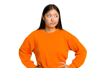 Young Asian woman isolated confused, feels doubtful and unsure.