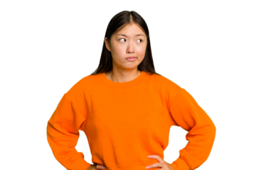 Young Asian woman isolated confused, feels doubtful and unsure.
