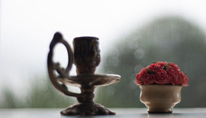 Still life of empty chandelier and bouquet flower 