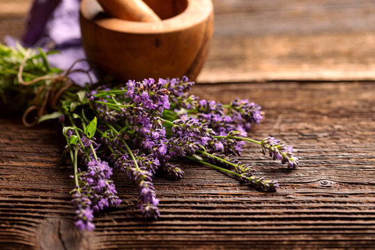 Close view of a fresh lavender bouquet on a wooden rustic table