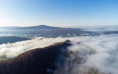 aerial view of a rural area covered with a layer of fog
