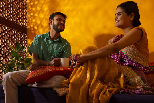Portrait of Gujrati couple talking in living room