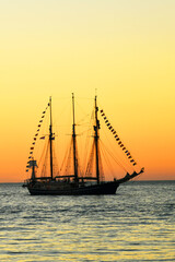 Sailing vessel at sunset.