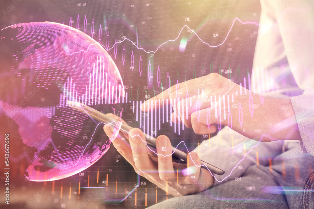 Poster double exposure of man's hands holding and using a digital device and forex graph drawing. financial