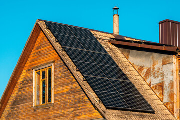 Roof of an old wooden house with Solar Panels