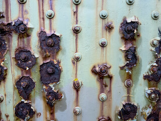 Scratched metallic surface with paint and rust stains - stock photo