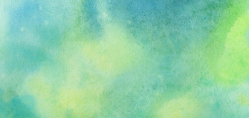 Green watercolor background for design. Abstract yellow and green spots blurred by water.
