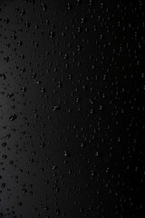 Water droplets on the floor with black background
