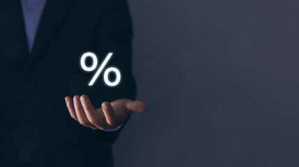 Businessman hands showing percentage symbol icon. Investing profits increases or decreases of stocks.
