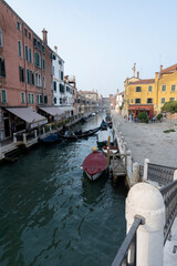 The canals in Venice with gondolas and boats, traditional vehicels of transport in Venice, Italy